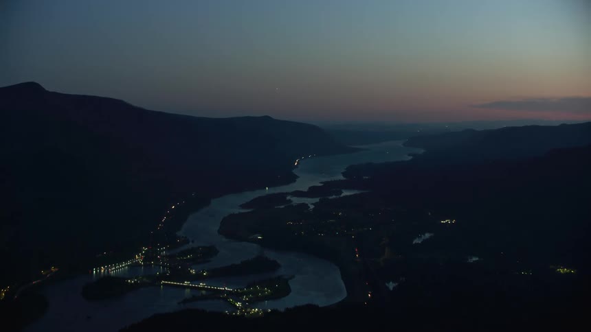 Aerial time lapse shot of Bonneville dam and the lower Columbia River as the camera flies down the Columbia River towards Portland Oregon