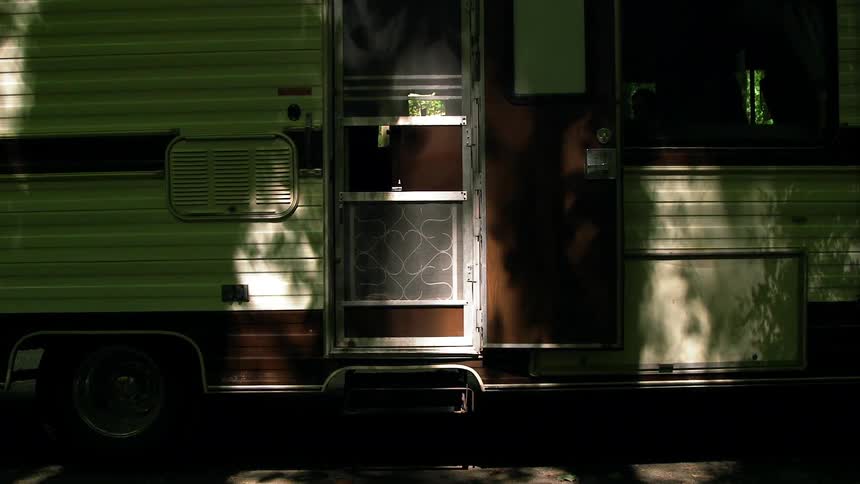 Dappled sunlight on a camper