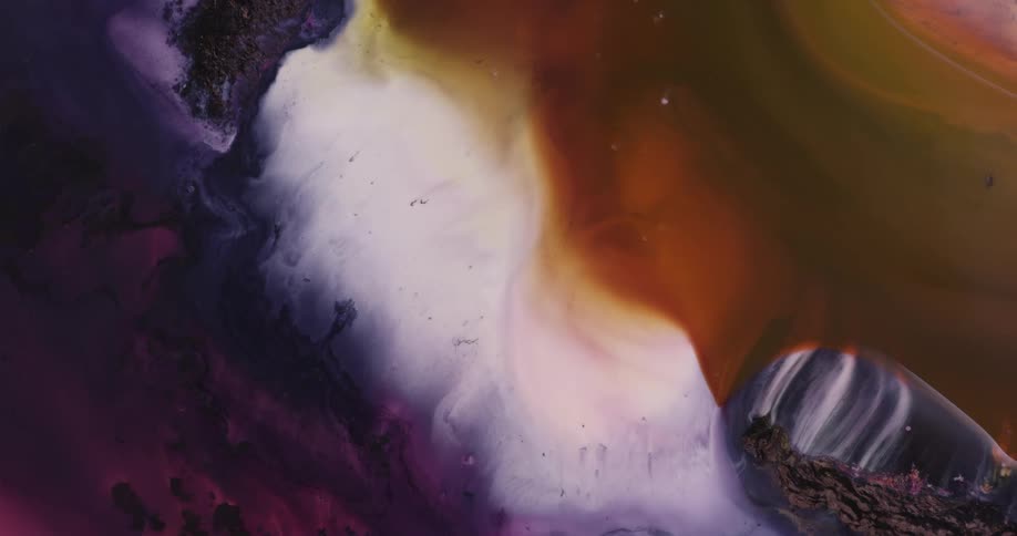 White smoke swirls and mixes with colors