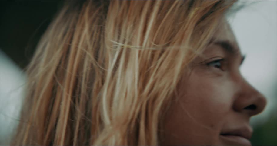 Close up of blonde female painters face smiling