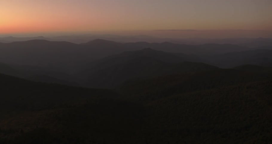 Mist covers the mountains at night