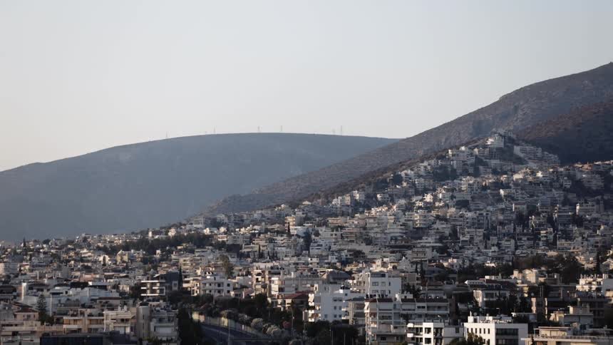 White buildings in the city on the side of a hill