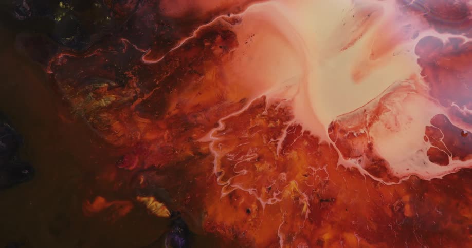 Pastel colors combine with red paint to create a swirl pattern