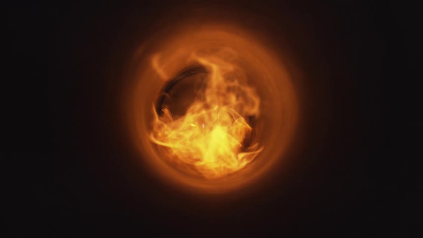 A fire grows brighter as it ignites and moves within a tube
