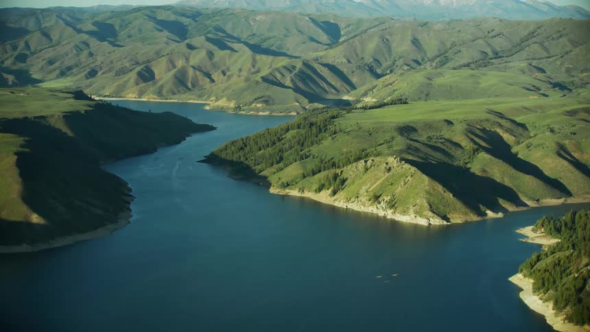 Aerial view of  4 backcountry airplanes flying above Anderson Ranch reservoir outside of Boise Idaho