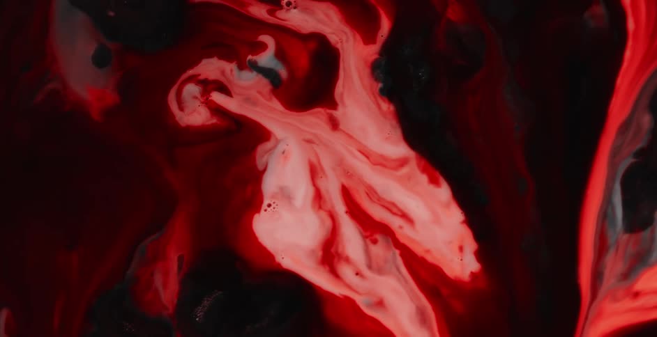 Bright red colored fluids intermingle with dark red and black fluids