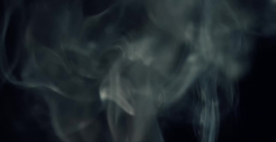 Smoke billows upward and out