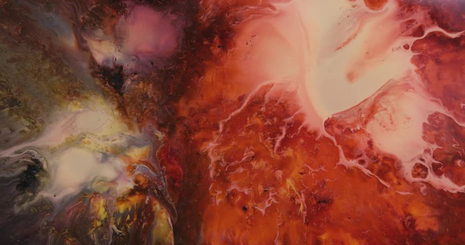 Chaotic swirls and strands of white liquid ink spreading over a multicolor background