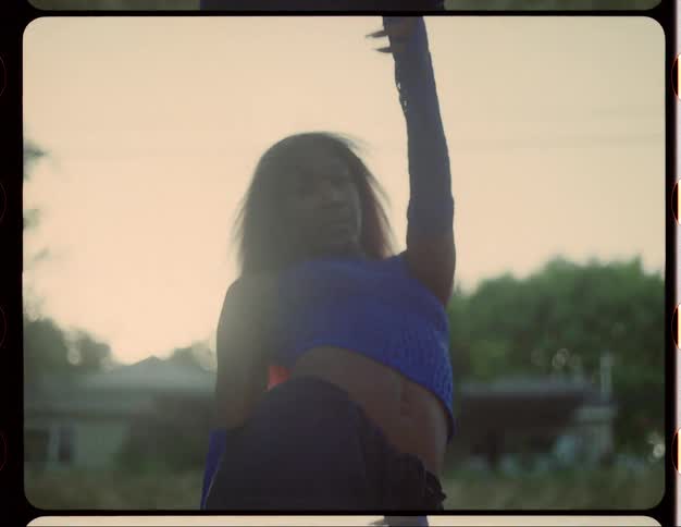 A woman is dancing in a stadium