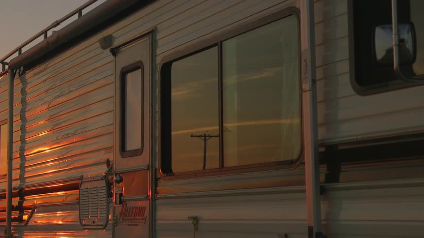 An rv at sunset