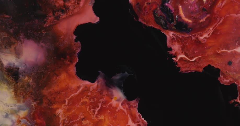 Black spreads through predominantly red colored mixture