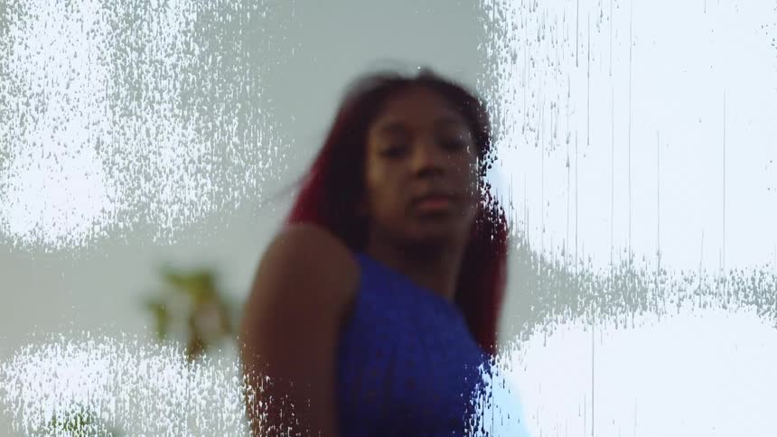 White fuzzy static flows over image of female dancing outdoors