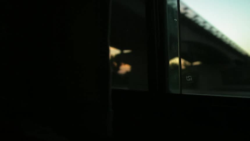 View from a car interior in a rural area at sunset
