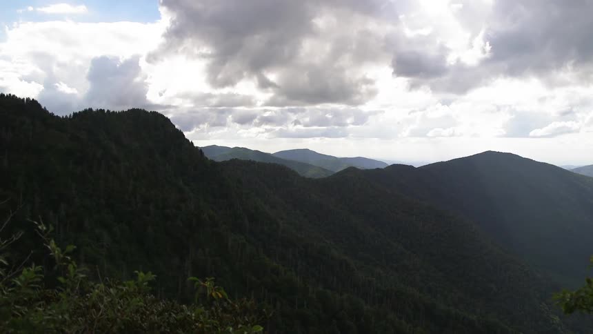 Tree lined hills on a cloudy day