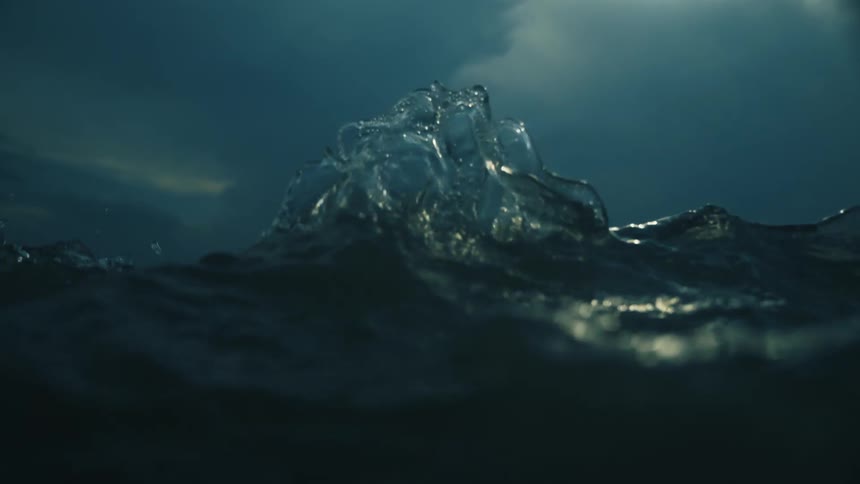 Turbulent waves crash over the camera during a hurricane