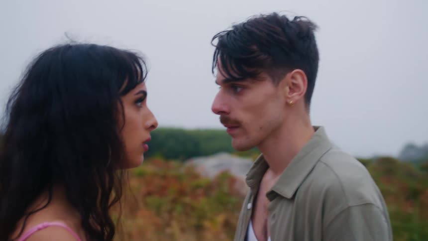 Boyfriend and girlfriend are hugging outdoors together