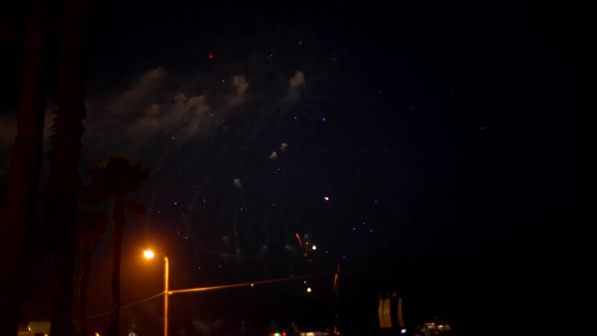 View of a fireworks display at night in the city