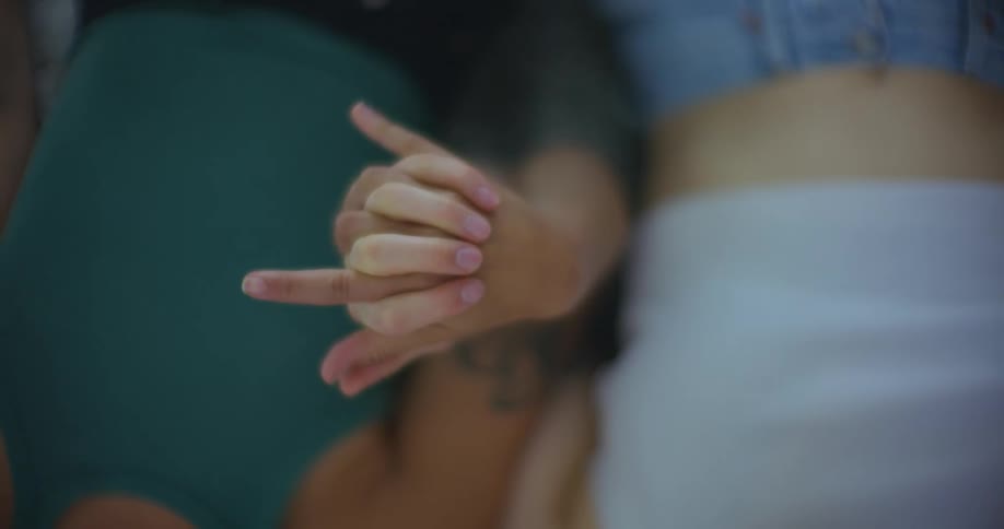 A man and woman are holding hands