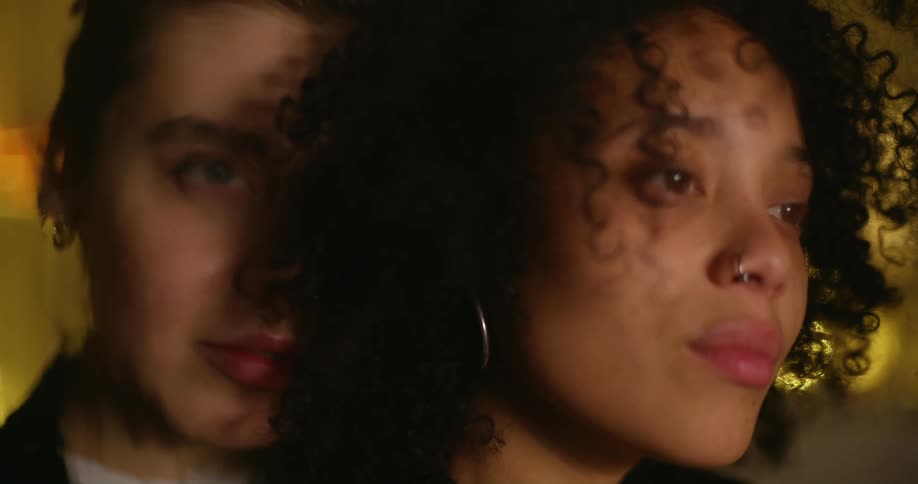 Two women hugging each other