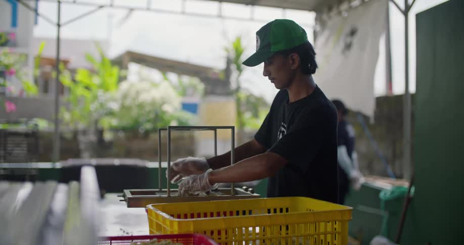A man is preparing food in a restaurant