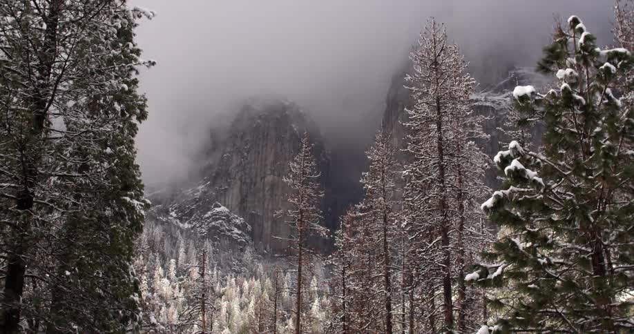 Fog over a snowy mountain