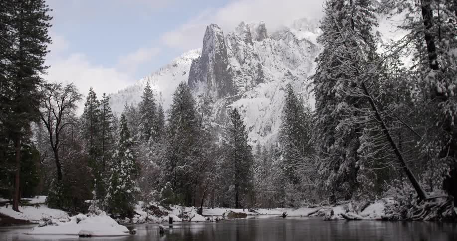 A lake located in a wintry, mountain landscape