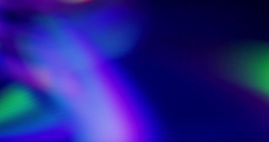 Beams of light in various colors move across dark background
