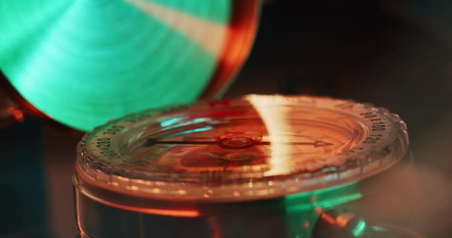 The needle spins on a compact style compass