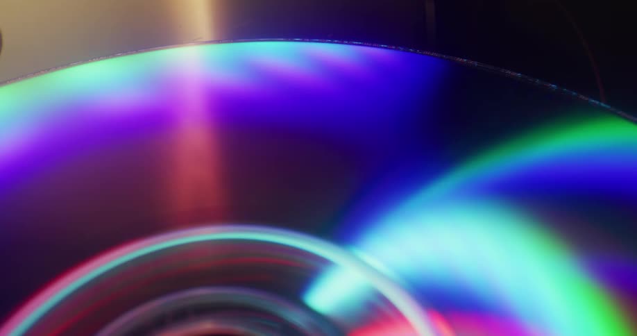 Light shines across iridescent surface of dvd