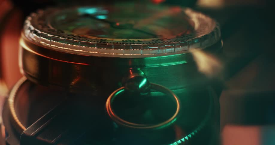 The needle spins on a compact style compass