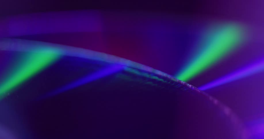 Colored lights reflect on the discs