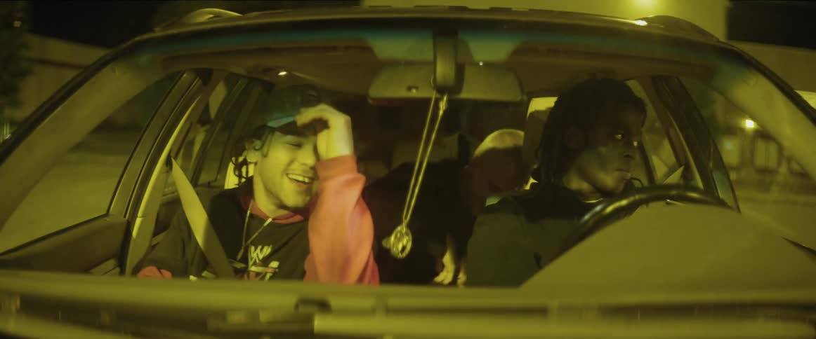 Teenagers have fun in the moving car