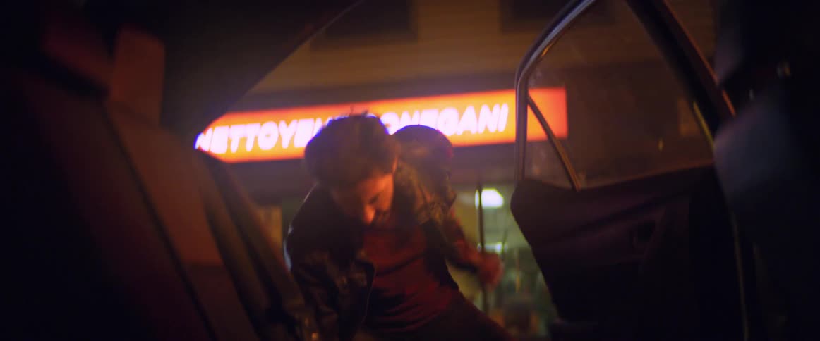 A man is removed from the vehicle and thrown to the ground