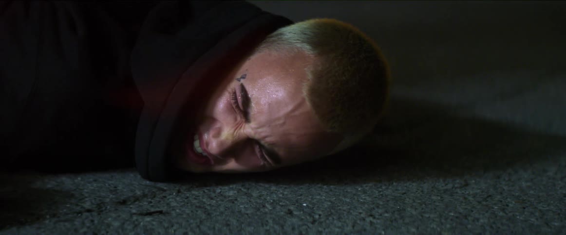 A man cries out after falling to the ground