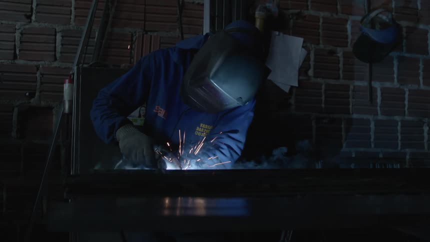 Sparks fly as a person welds