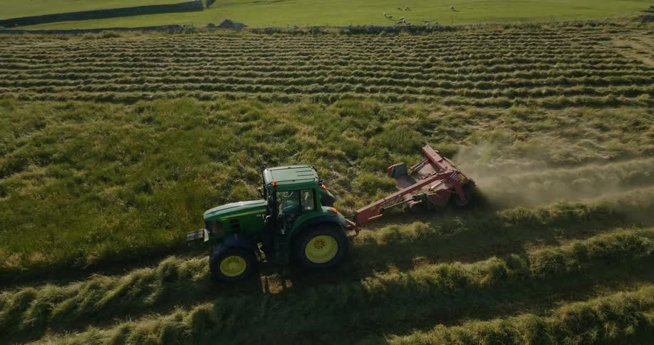 An aerial view of a tractor plowing a field
