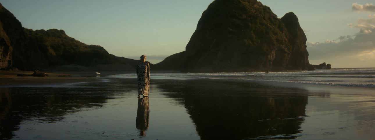 There is person outdoors by nature next to a lake