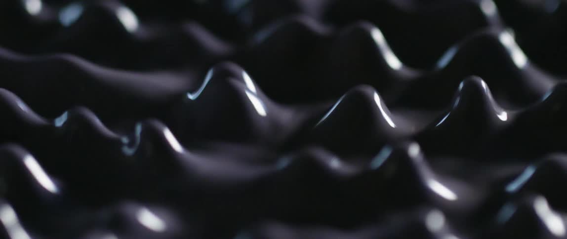 Dark colored liquid bounces