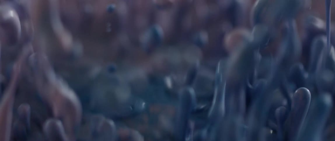 Pink and blue liquid vibrating and bouncing upwards