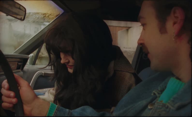 A view of a man and woman in a car