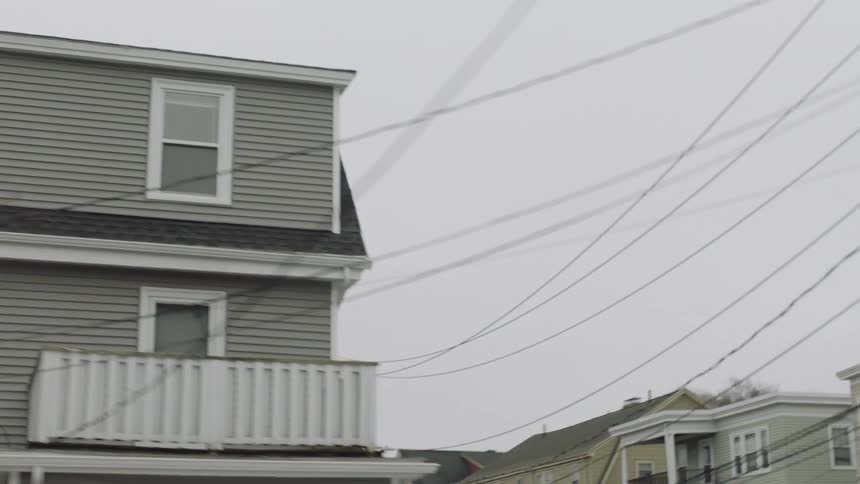 Cars are parked on city streets during winter