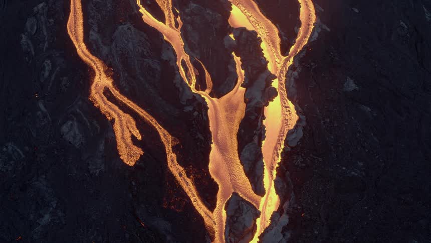 Lava flowing over volcanic rock
