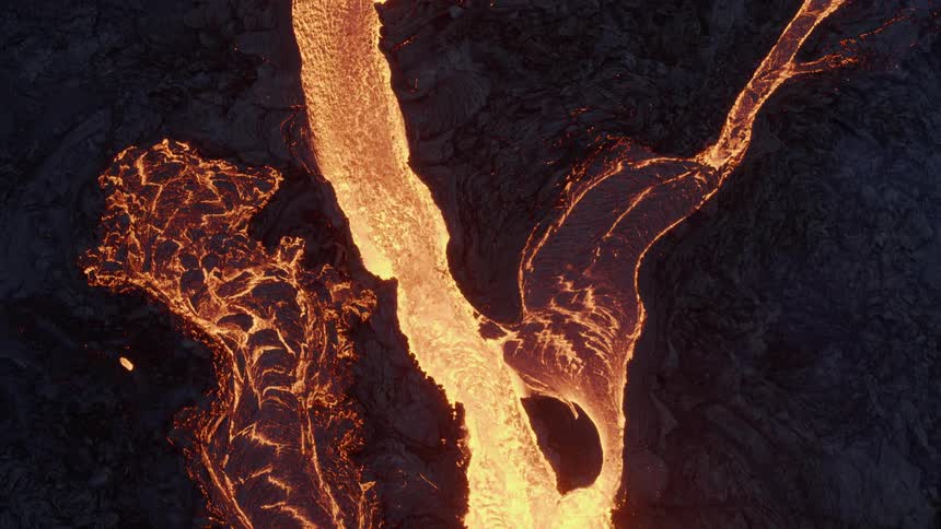 Lava is quickly flowing down a volcano