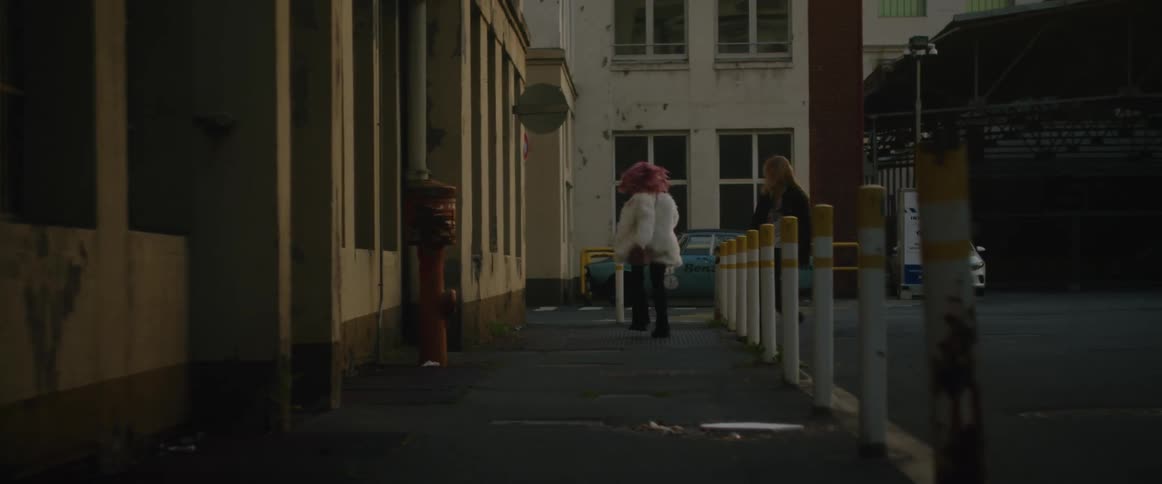Two friends are having fun in a downtown city together