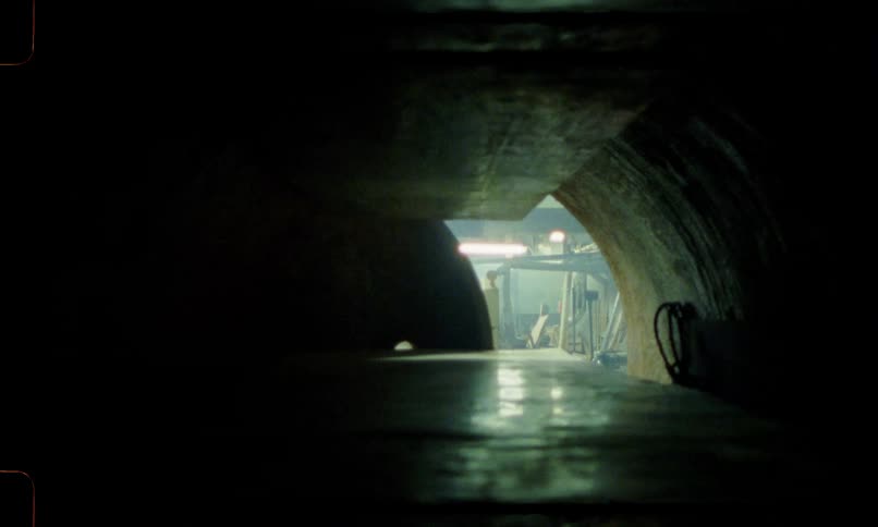 The circular door of an oven furnace is slowly closed blocking out light