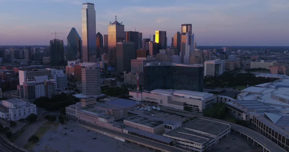 Aerial view of skyscrapers on the city skyline reflecting the morning sunlight