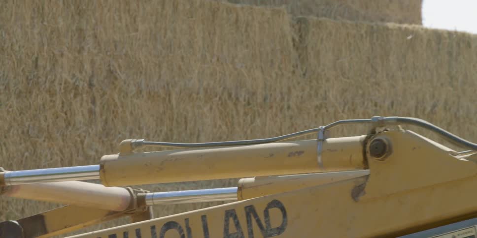 A person drives some heavy machinery