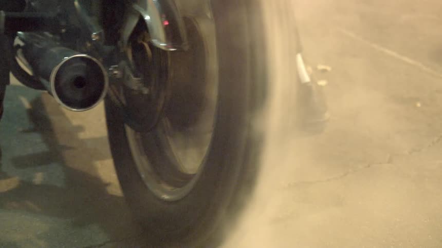 Back tire of a motorcycle bending while not going forward because the rider has applied the front brake