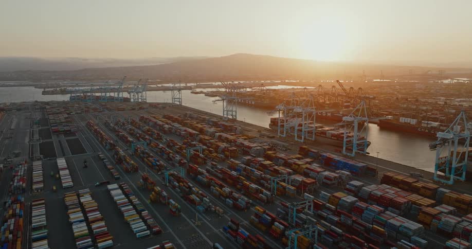A large shipping yard on a waterway in the evening