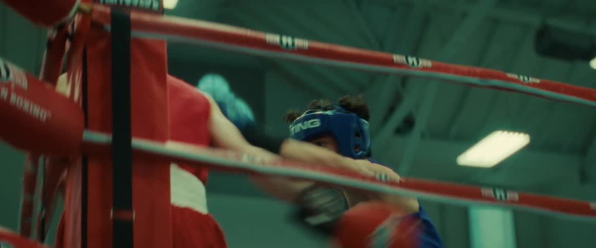 Two men are boxing in the ring